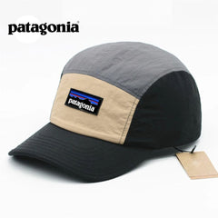Patagonia cap with beige and gray color scheme on a white background